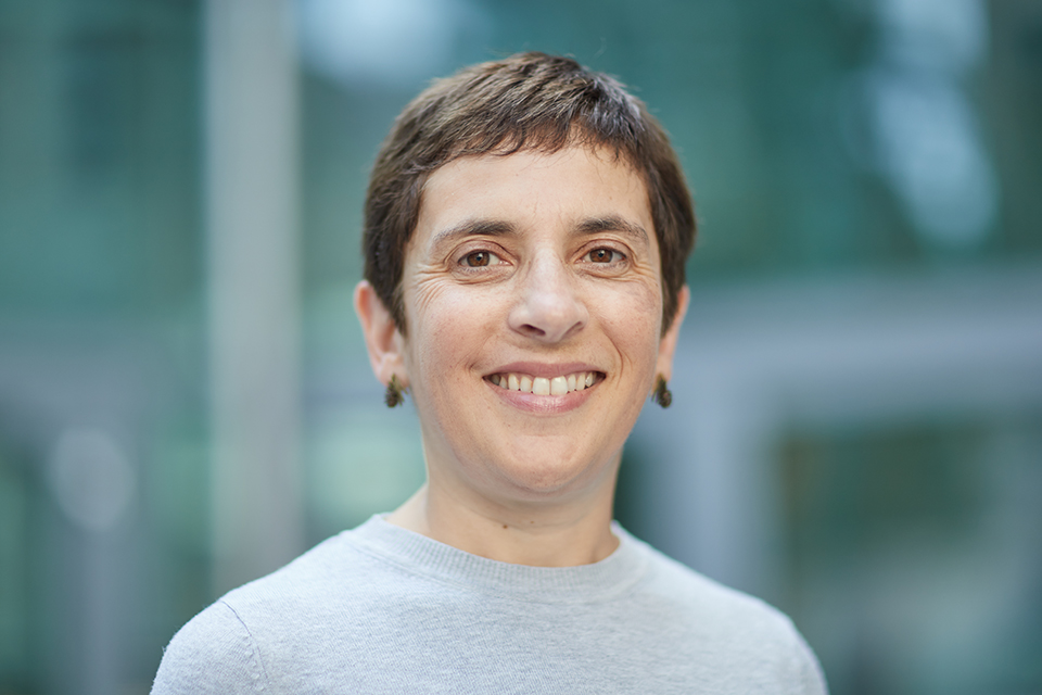 Naomi Mallick, Director for Ministry of Justice's Legal Services smiles, looking straight into the camera. The shot shows her head and shoulders.